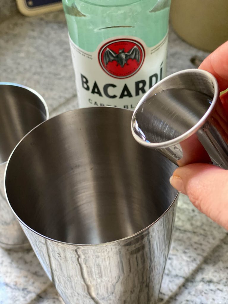 Pouring sugar syrup into shaker