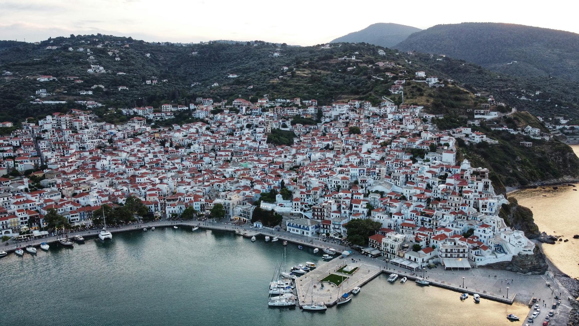 an aerial photography of city of skopelos island in greece